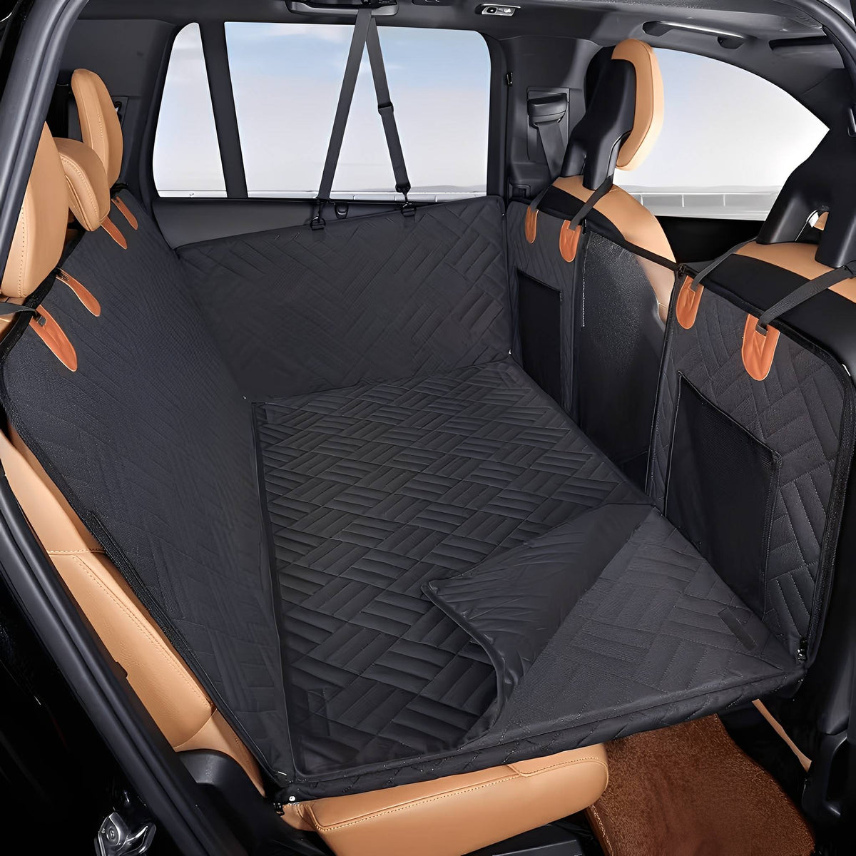 Empty black quilted seat extender spread across the back seat of a car, with mesh side pockets and a partly folded flap. 7