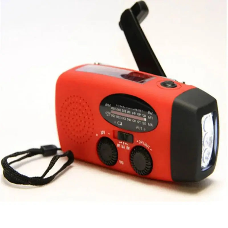 Red crank radio from the right with the dial, tuning knobs, bright torch and black wrist strap 5