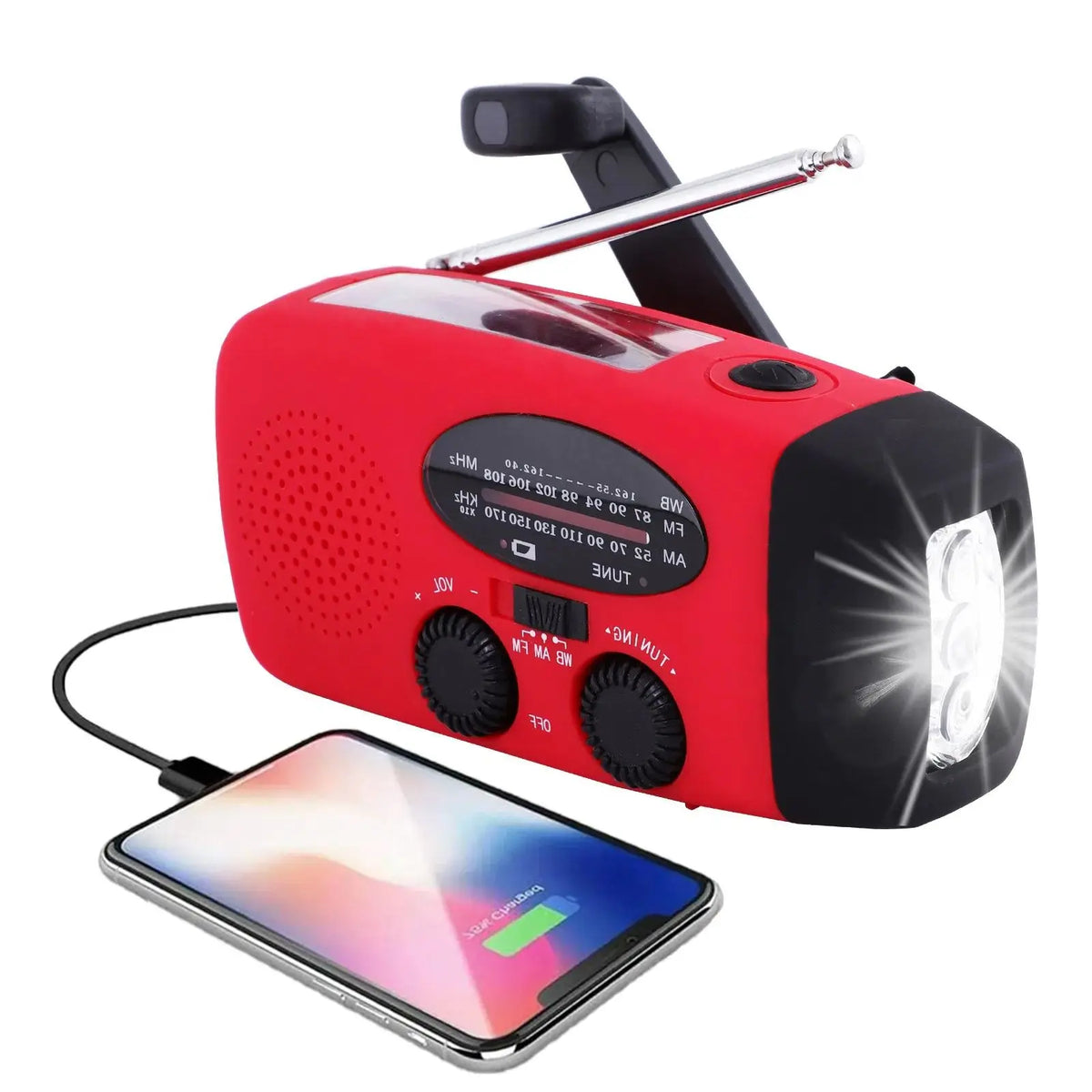 Red crank radio angled left with the torch lit, charging a smartphone by USB cable 1