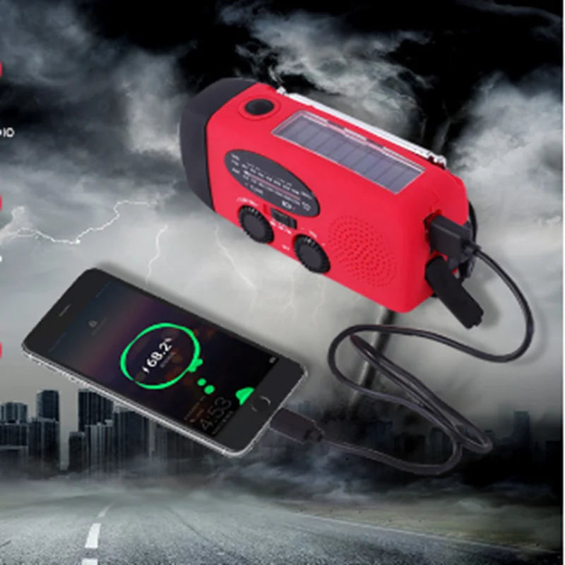 Red radio's solar panel on top, with a phone charging from it against a stormy sky 6