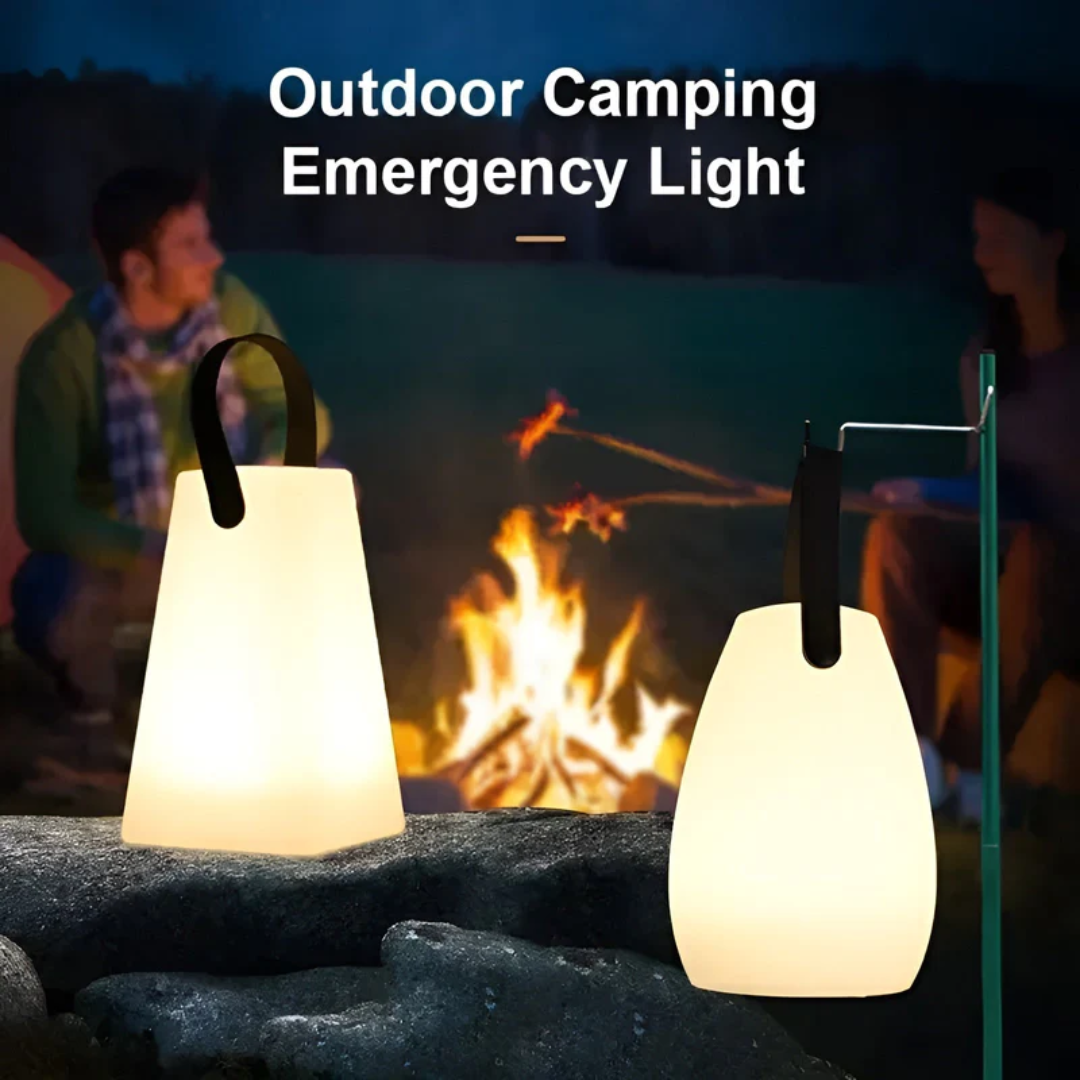 Two glowing lamps by a campfire, one on a rock and one hanging from a pole 3