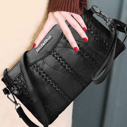 Women's PU-leather crossbody clutch with a spacious interior.