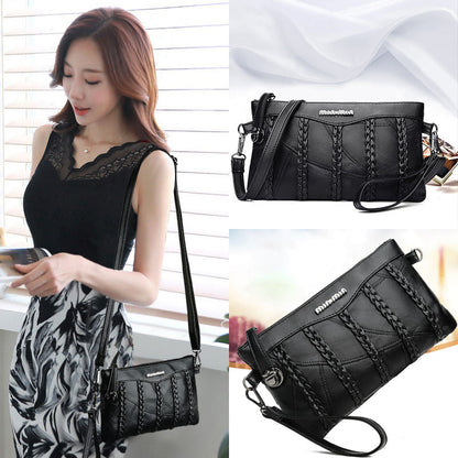 Women's PU-leather crossbody clutch with a spacious interior.