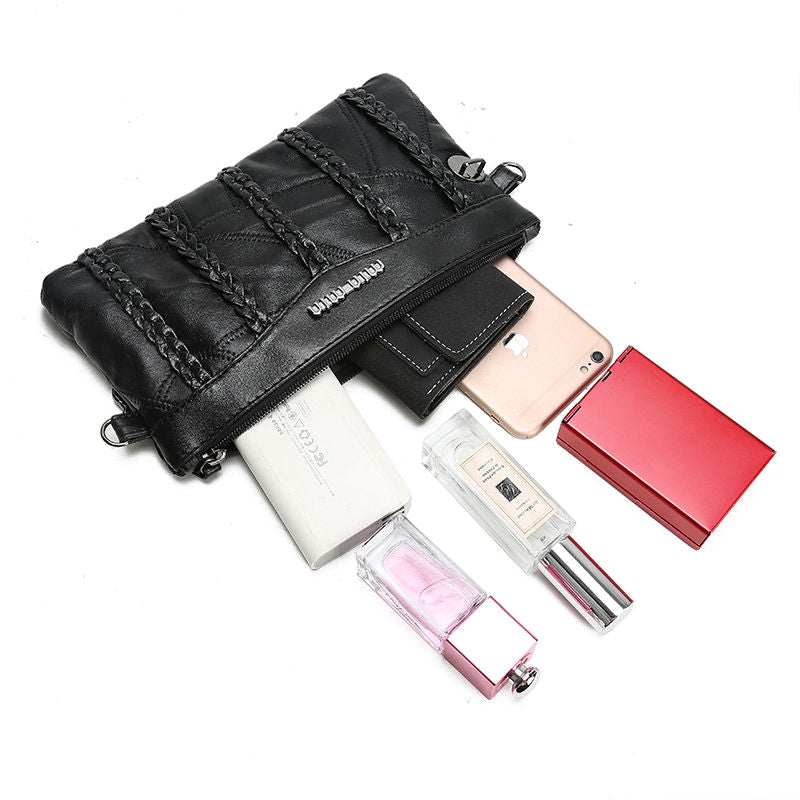 Women's PU-leather crossbody clutch with a spacious interior.