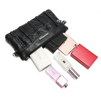 Women's PU-leather crossbody clutch with a spacious interior.