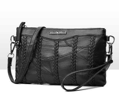 Women's PU-leather crossbody clutch with a spacious interior.