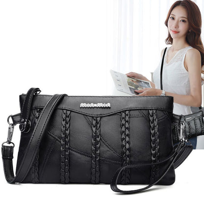 Women's PU-leather crossbody clutch with a spacious interior.