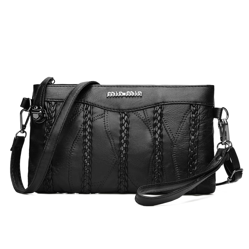 Women's PU-leather crossbody clutch with a spacious interior.