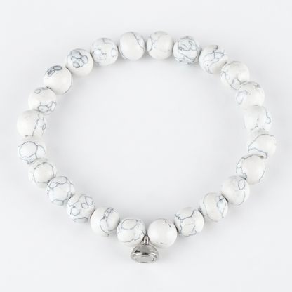 White marbled beaded bracelet with grey veining and a small silver charm, on a white background 6