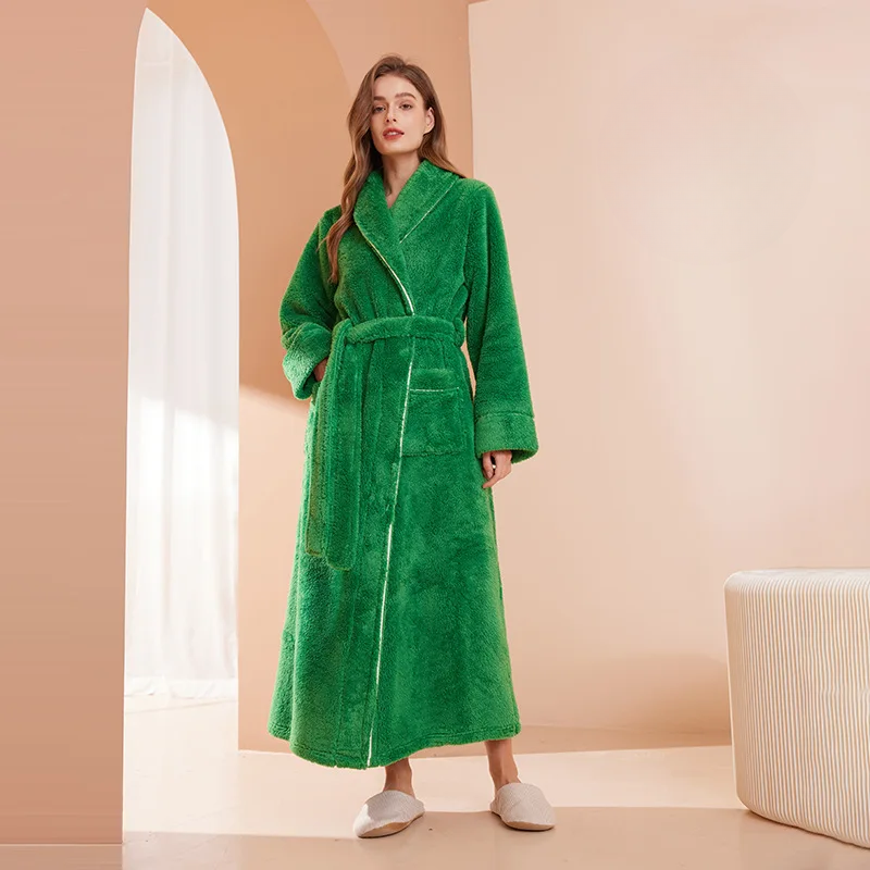 Model in a bright green fleece robe with a shawl collar, belted, standing by an arched doorway 6