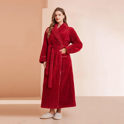 Model in a deep red fleece robe with one hand in the pocket and long belt ends hanging 7