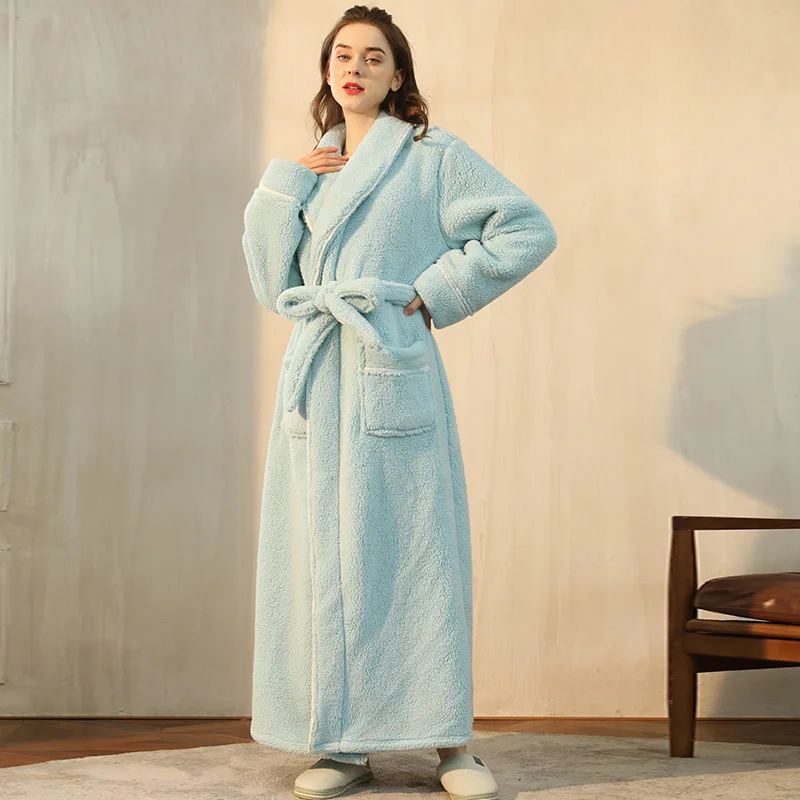 Model in a light aqua fleece robe, one hand on her hip, belt tied in a loose bow 9