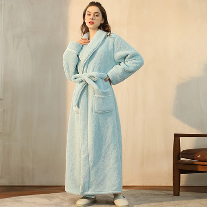 Model in a light aqua fleece robe, one hand on her hip, belt tied in a loose bow 9