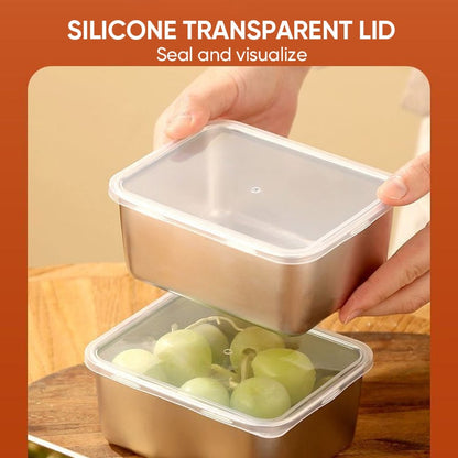 Hand placing a clear lid onto a steel container of green grapes while another hand holds a second lidded container above it. 9