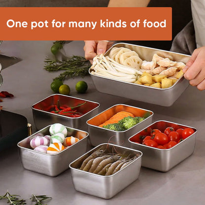 Several steel containers holding mushrooms, prawns, tomatoes, broccoli, chillies and sweets, with a hand lifting a larger tray of lotus root and ginger. 3