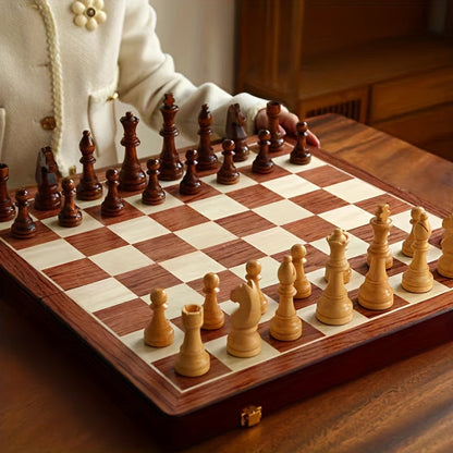 Board set up for play with a woman's hand behind the dark pieces, seen from the light side 5