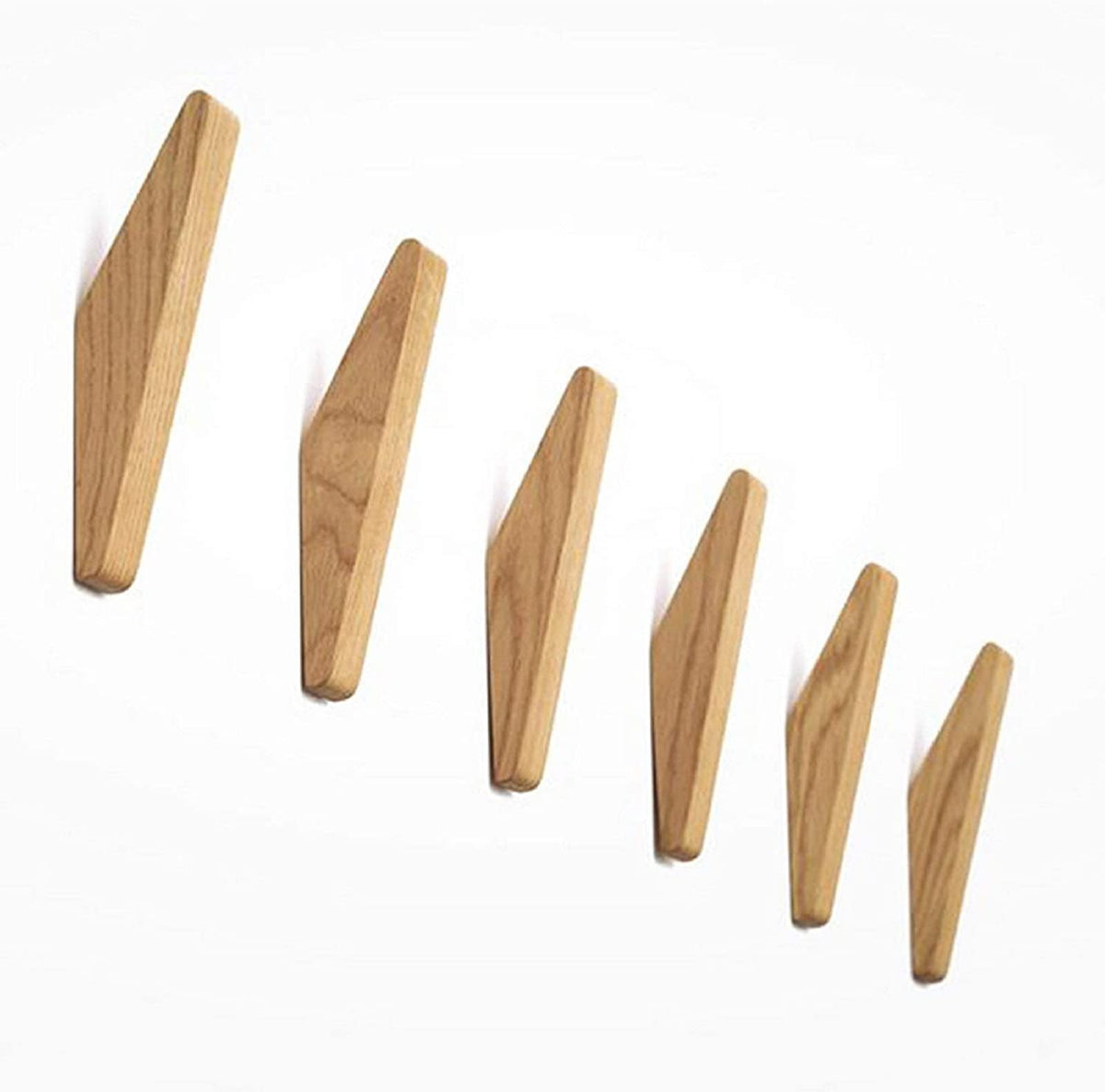 Six wooden hooks in graduating sizes arranged in a diagonal line on white, showing the grain of the wood. 5