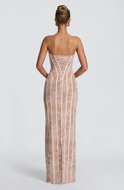 Back view of the blush pink lace dress, showing the corset lacing, bow ties and central hem slit. 14