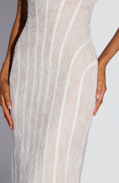 Close-up of the white lace torso and hip, showing the delicate floral lace, beading and sequins and the curved boning. 12