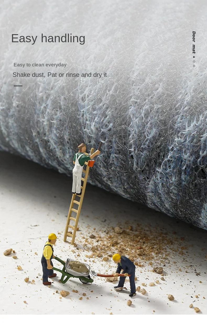 Close-up of the loose looped pile, with miniature workers clearing spilled dirt, illustrating easy cleaning 12