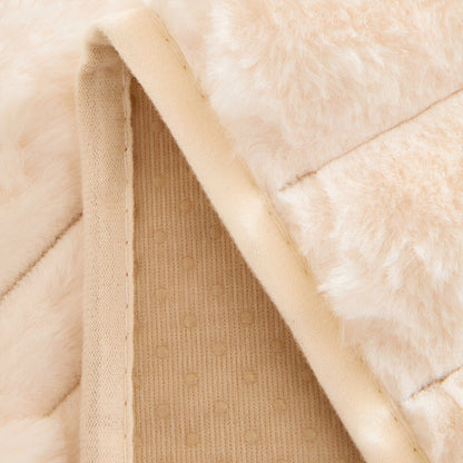 Close-up of a folded corner showing the stitched edge binding and the beige underside with a dotted anti-slip pattern. 6