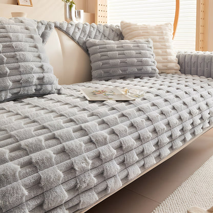 Light grey version of the plush cover fitted across the sofa seat, backrest and arm. 10