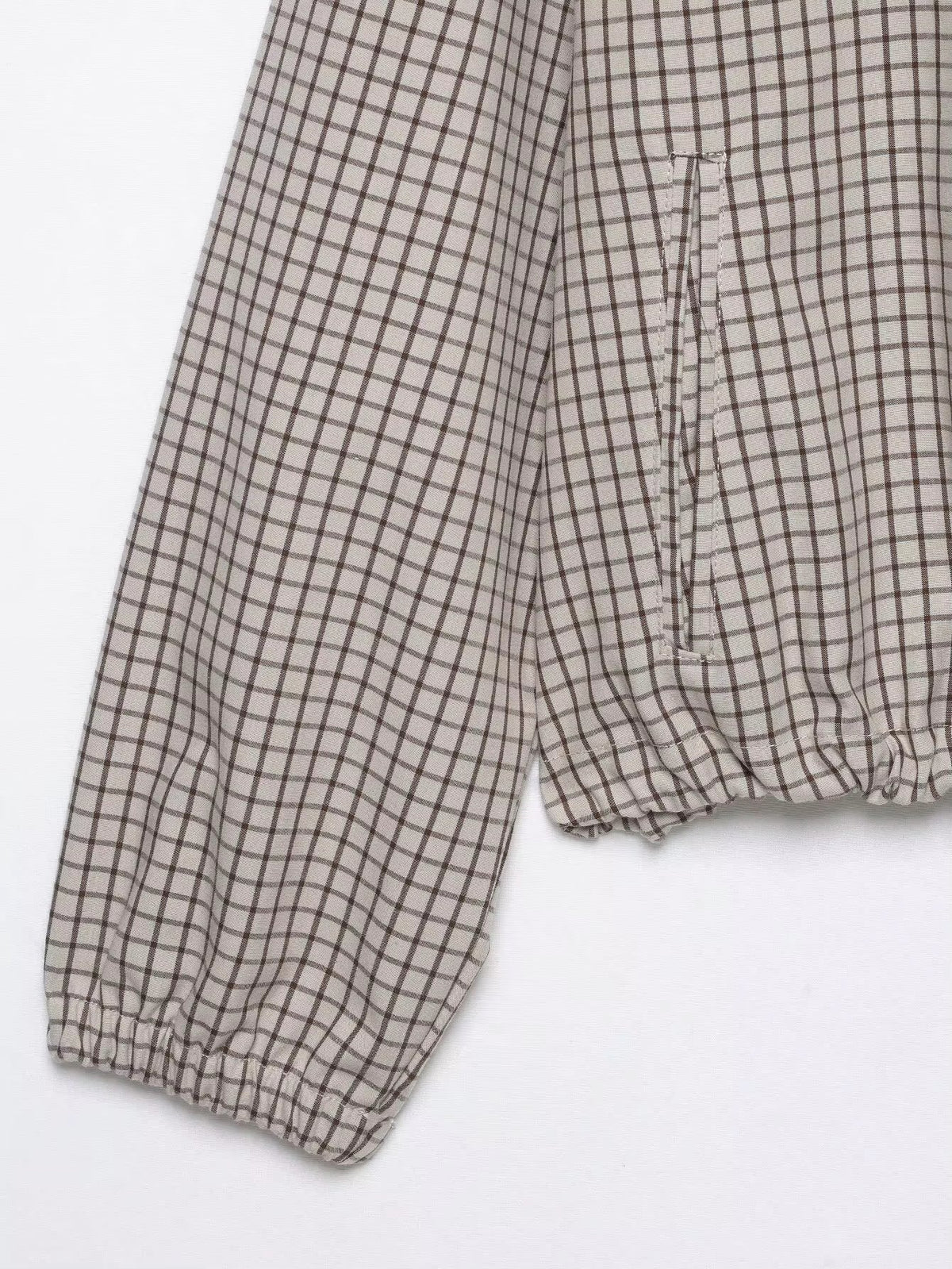 Flat lay detail of the sleeve with elasticated cuff, side pocket opening and gathered hem. 8