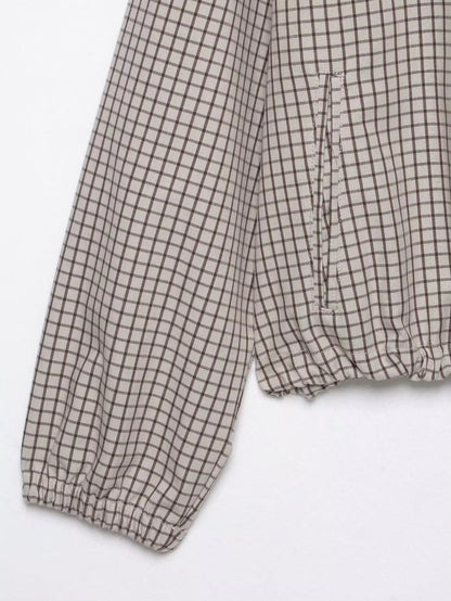 Flat lay detail of the sleeve with elasticated cuff, side pocket opening and gathered hem. 8