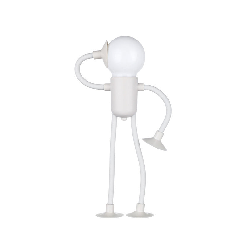 White figure-shaped night light with a round bulb head, one bendy arm raised to its head and suction cups on hand and feet. 2