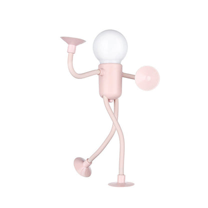 Pink figure lamp with a frosted bulb head, one arm raised, one leg lifted mid-stride and suction cups at every limb tip. 3