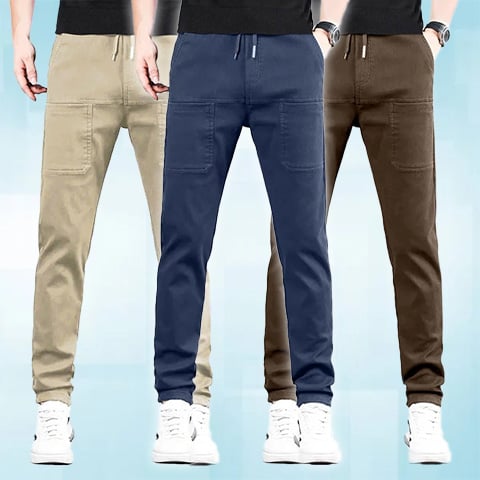 Three models in a row wearing the trousers in beige, navy and brown 22
