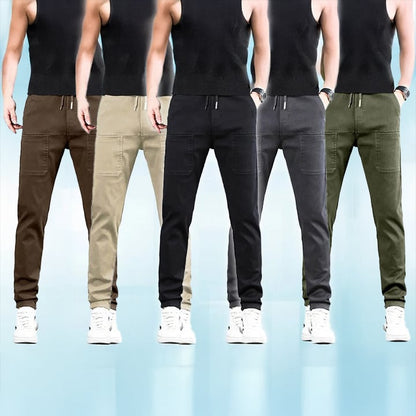 Five models in sleeveless black tops showing the trousers in brown, beige, black, grey and green 23