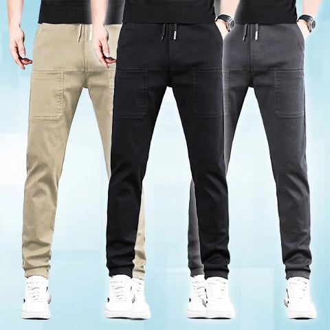 Three models wearing the trousers in beige, black and dark grey, with large front pockets 24
