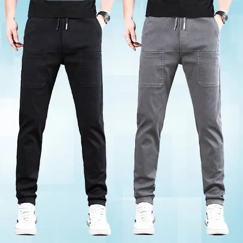 Two models wearing the trousers side by side, one in black and one in grey 25