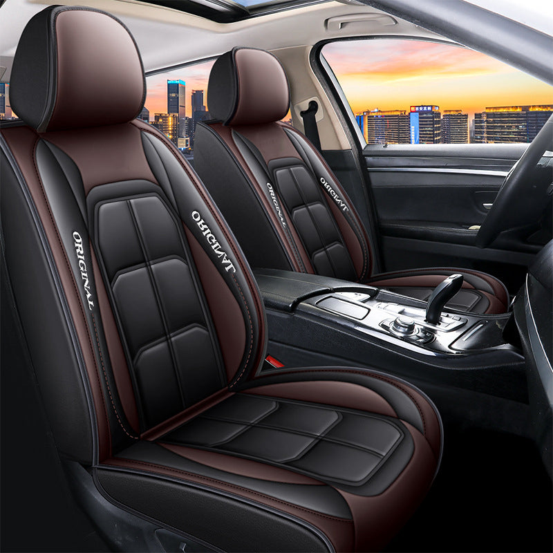 Front seat covers in black and brown with contrast stitching, shown fitted to both front seats of the car. 12