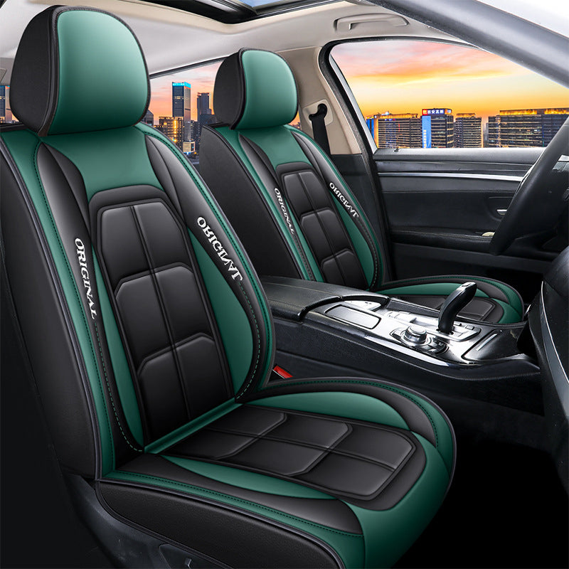 Front seat covers in black and green with quilted panels, shown fitted to both front seats of the car. 13