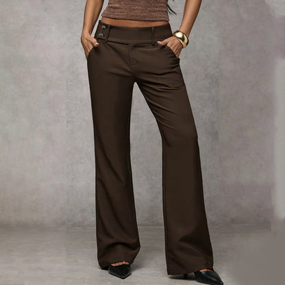 Model wearing dark chocolate-brown wide-leg trousers with button waist detail, hands in pockets, front view with black heels. 5