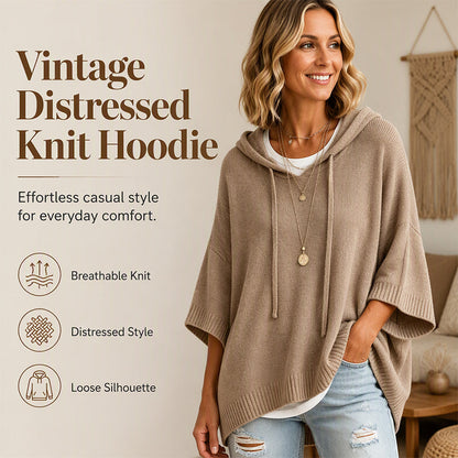 Smiling woman in a taupe oversized hooded knit with drawstrings, worn over a white top and ripped jeans, beside a feature panel. 1