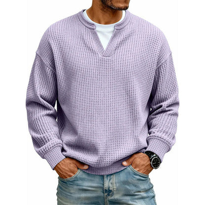 Front view of the waffle knit V-neck top in lilac, worn over a white tee with light jeans. 19