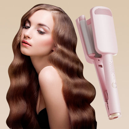 Pink wave iron next to a woman with long, glossy, softly waved auburn hair 7