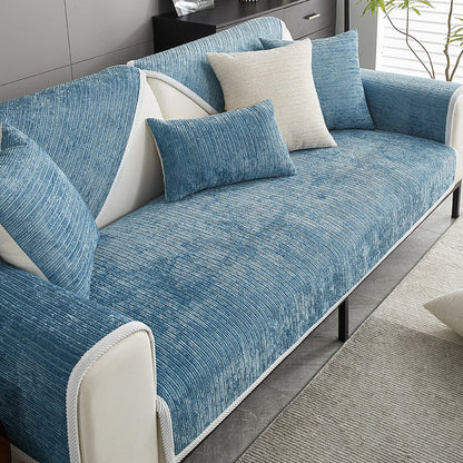 Blue ribbed chenille cover fitted over the seat, back and arm of a cream sofa with matching cushions. 2