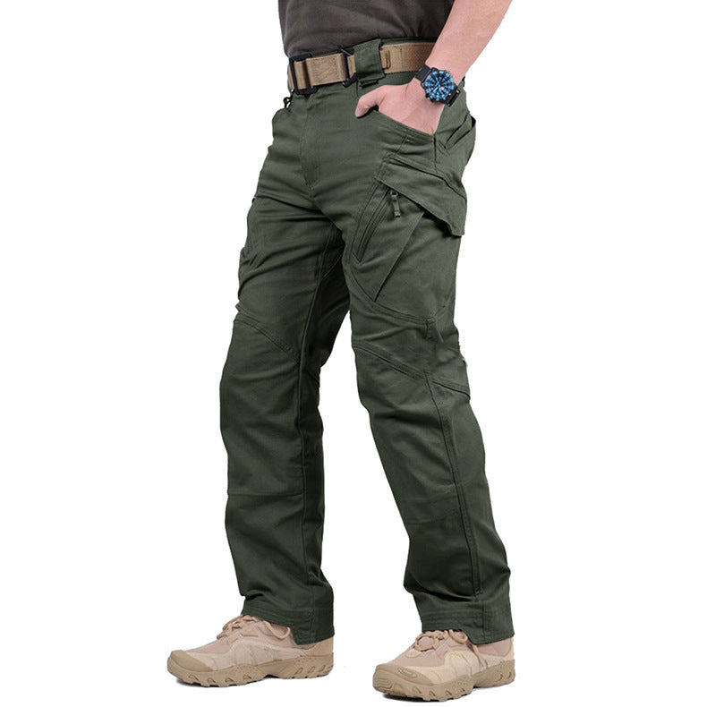 Side view of the trousers in olive green, worn with a tan belt and desert boots 4