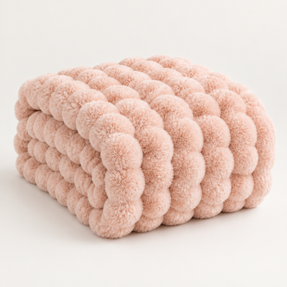Pink plush blanket folded into a thick stack, showing large fluffy bubbles against a plain background 15