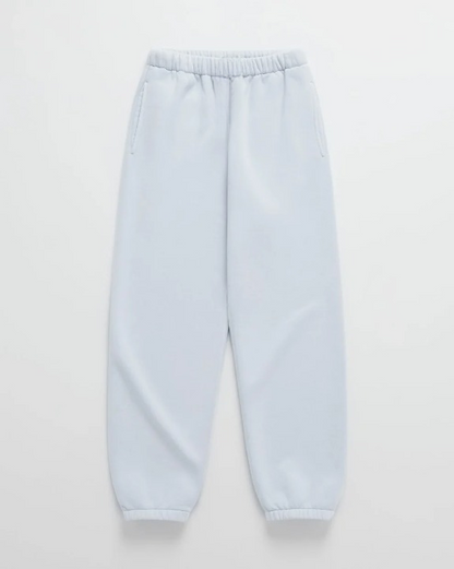 Flat lay of pale blue joggers with an elasticated waist, side pockets and fitted cuffs at the ankles. 9