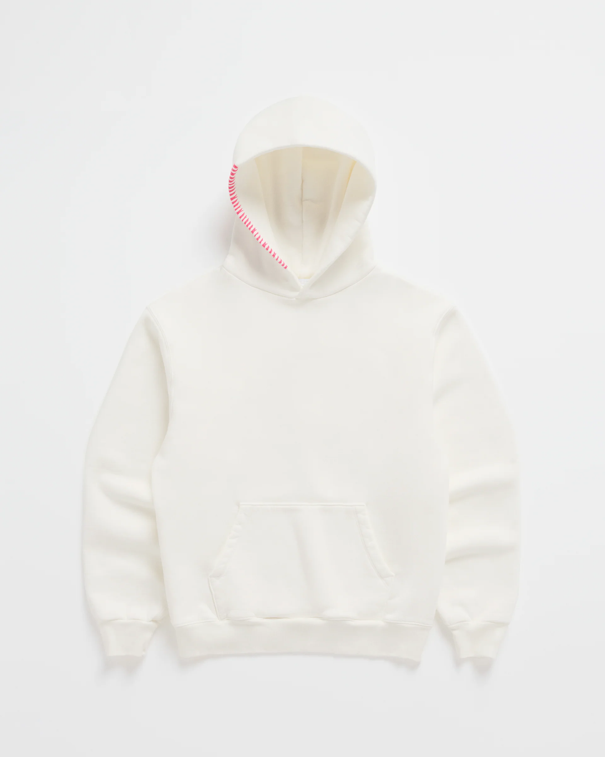 Flat lay of the cream hoodie with a kangaroo pocket and bright pink stitching running along one edge of the hood. 2