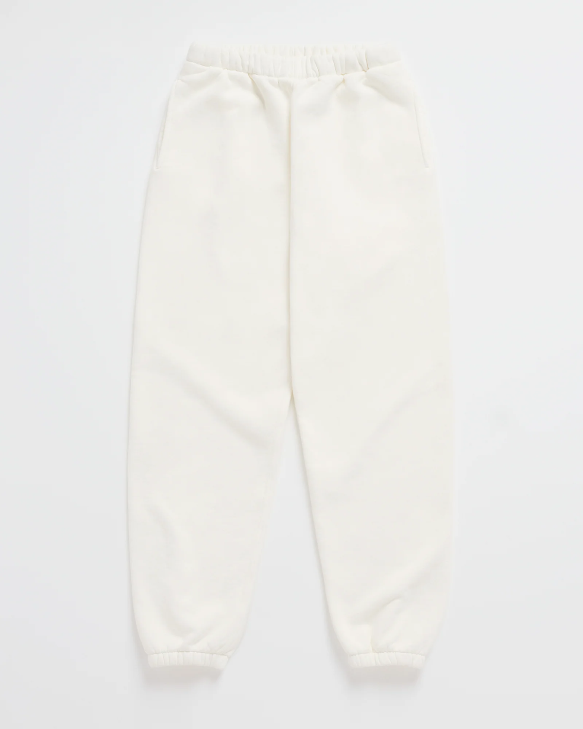 Flat lay of cream joggers with a gathered elastic waist, side pockets and elasticated ankle cuffs. 7