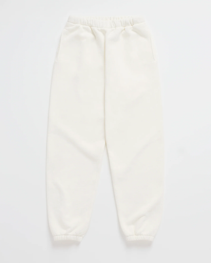 Flat lay of cream joggers with a gathered elastic waist, side pockets and elasticated ankle cuffs. 7