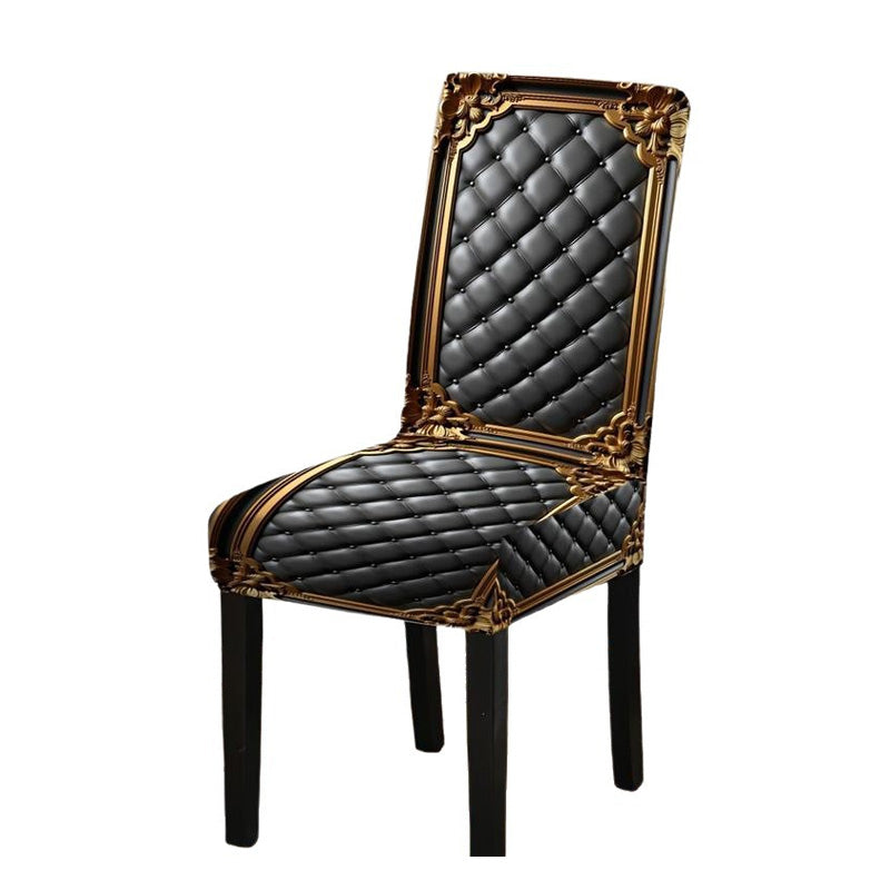 Single dining chair with dark legs wearing the black quilted cover printed with a gold baroque frame, on a white background. 9