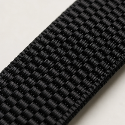 Close-up of the black woven elastic strap texture at an angle on a light background 5