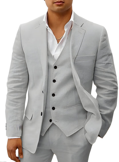 Model wearing the suit in light grey, with black buttons on the vest and jacket and one hand in pocket. 13